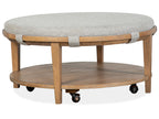 Lindon - Round Cocktail Table With Gray Upholstered Top & Casters - Belgian Wheat